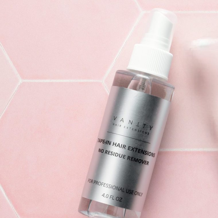 The Clean Remover — 4 fl oz no-residue tape remover on pink hexagon tile