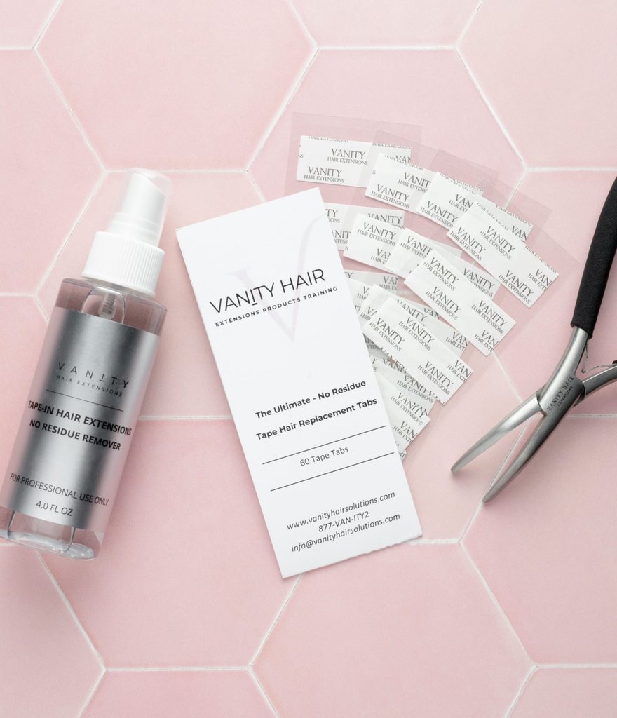 Vanity no-residue remover, replacement tab card and application pliers on pink hexagon tile